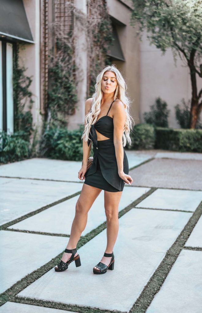 Erin Elizabeth of Wink and a Twirl share the cutest little black cutout dress for Spring from Shop Priceless 