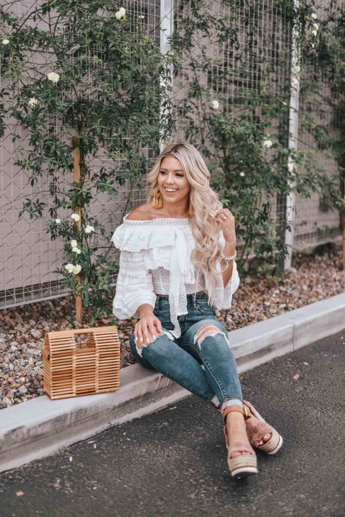 Erin Elizabeth of Wink and a Twirl shares the cutest white off the shoulder peasant top from Chicwish 