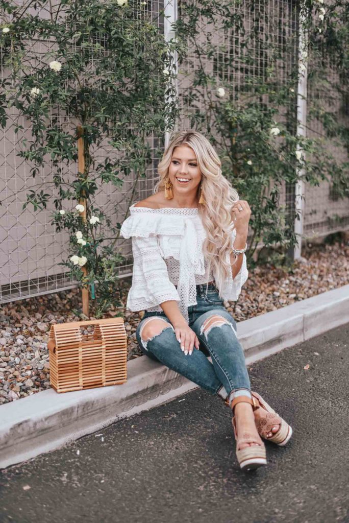 Erin Elizabeth of Wink and a Twirl shares the cutest white off the shoulder peasant top from Chicwish 