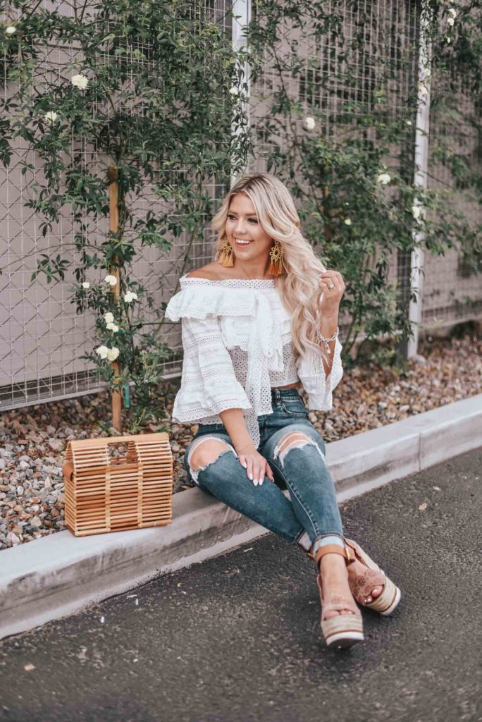 Erin Elizabeth of Wink and a Twirl shares the cutest white off the shoulder peasant top from Chicwish 