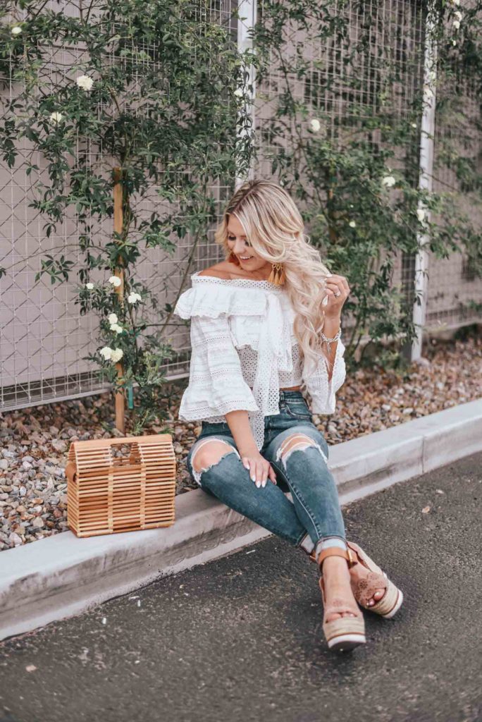 Erin Elizabeth of Wink and a Twirl shares the cutest white off the shoulder peasant top from Chicwish 