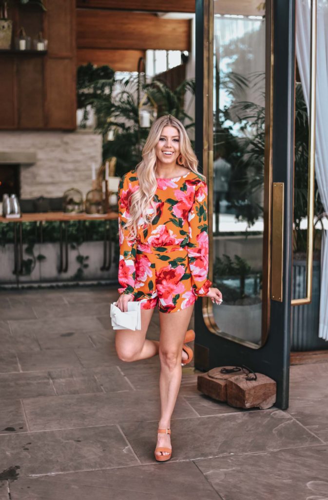 Erin Elizabeth of Wink and a Twirl shares the perfect floral romper and orange platform heels from Lulus