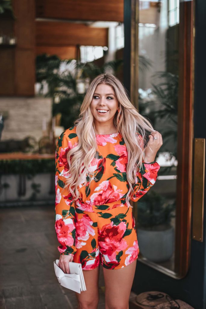 Erin Elizabeth of Wink and a Twirl shares the perfect floral romper and orange platform heels from Lulus