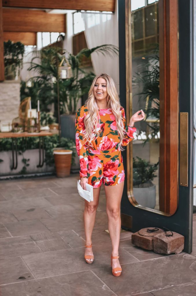 Erin Elizabeth of Wink and a Twirl shares the perfect floral romper and orange platform heels from Lulus