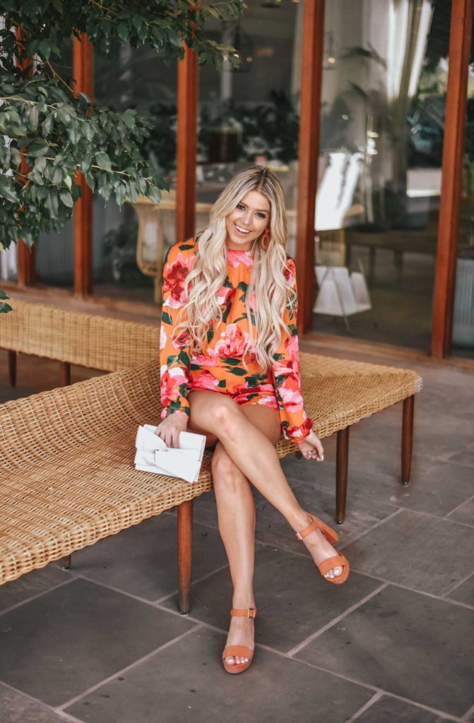 Erin Elizabeth of Wink and a Twirl shares the perfect floral romper and orange platform heels from Lulus